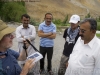 Bill Hanlon, Basic Health Int'l, and KADO rep Imran Khan present solar light to dispenser Mr Abdullah, Misgar village just north of Sost, Hunza Valley, Karakoram Range, Pakistan